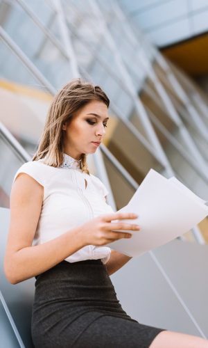 person-reading-erisa-disability-claim-outside Person sitting outside reading ERISA disability claim